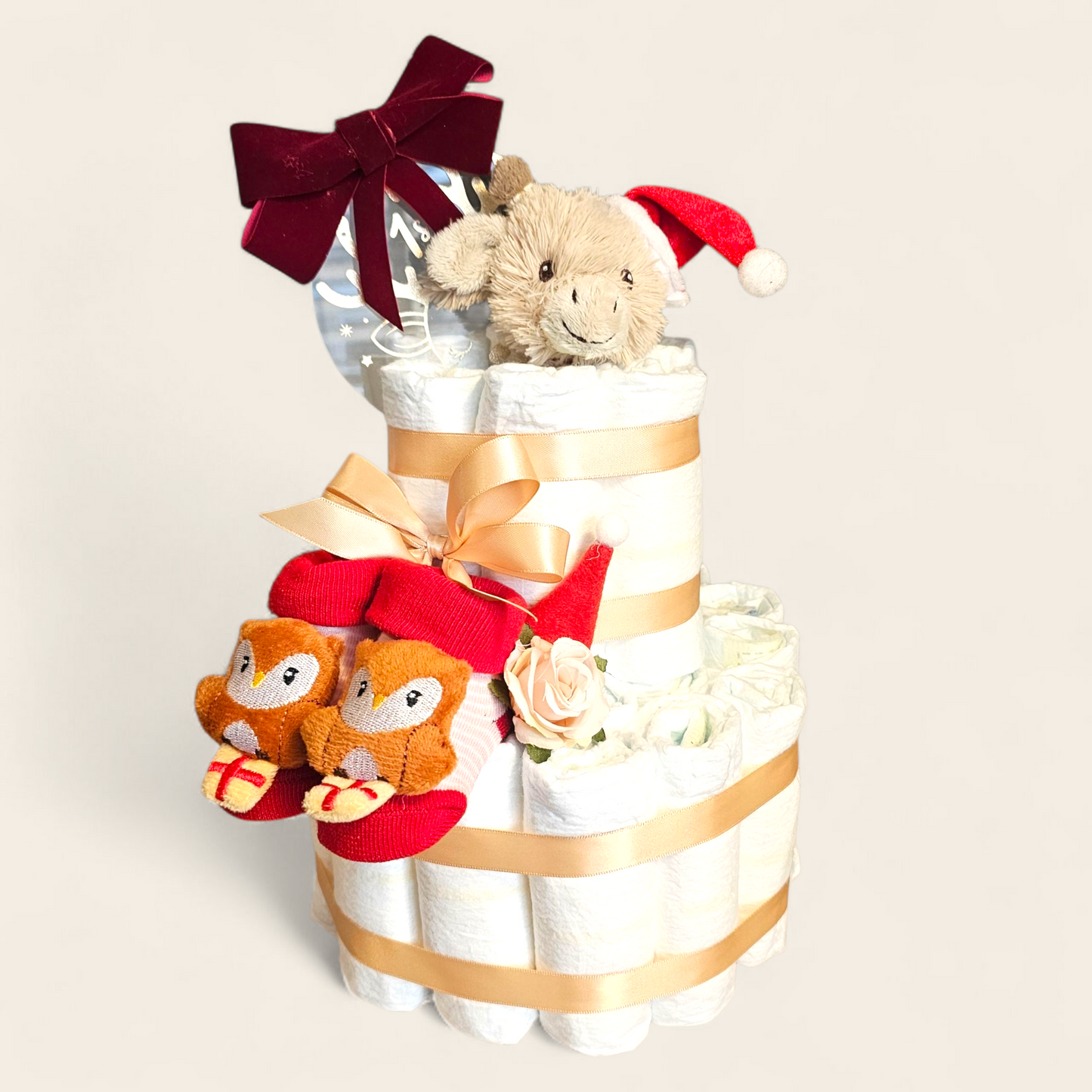 Luiertaart Kerst – Happy Horse Gus de Giraf met Pampers, Kerstsokjes & My First Christmas Bal