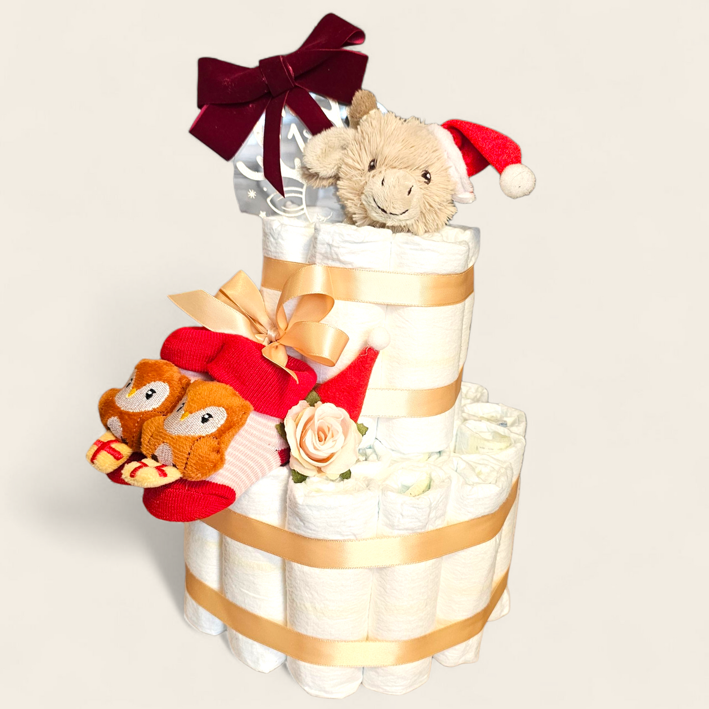 Luiertaart Kerst – Happy Horse Gus de Giraf met Pampers, Kerstsokjes & My First Christmas Bal