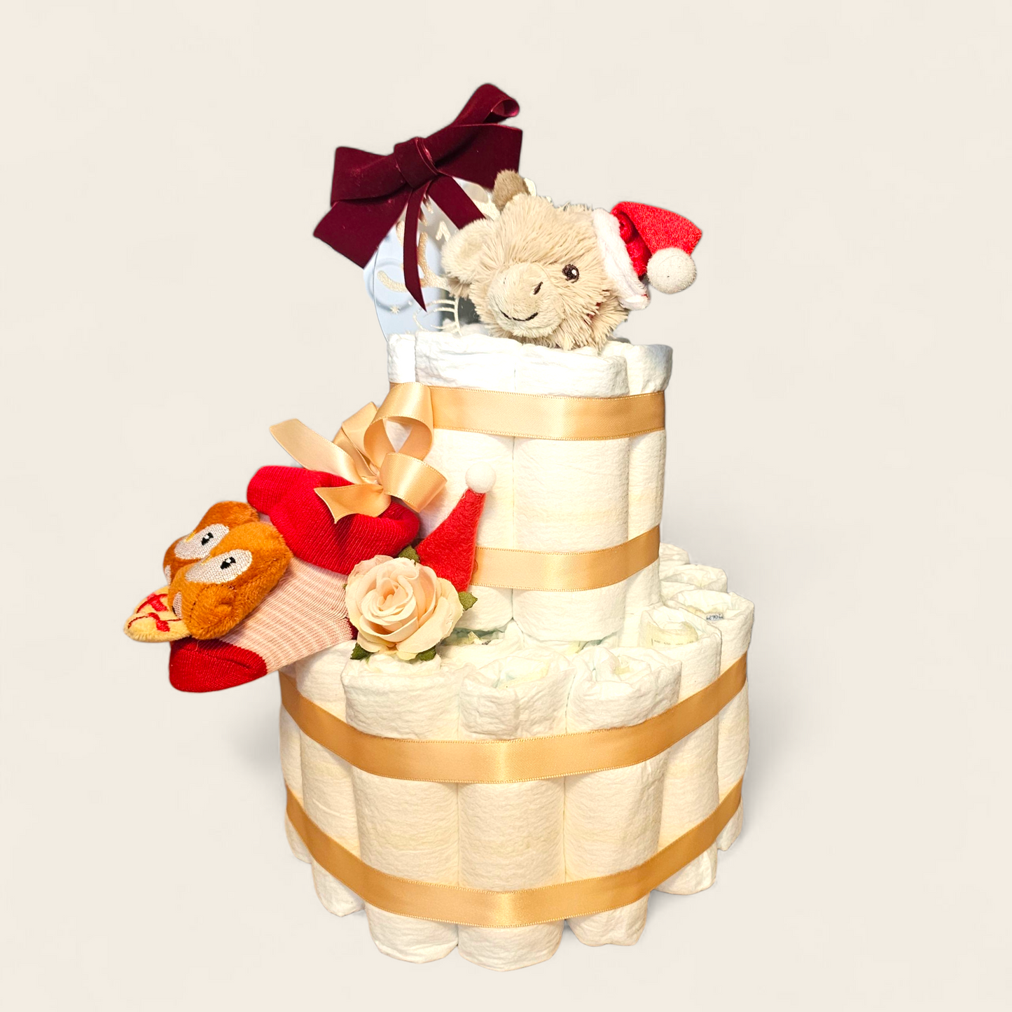 Luiertaart Kerst – Happy Horse Gus de Giraf met Pampers, Kerstsokjes & My First Christmas Bal