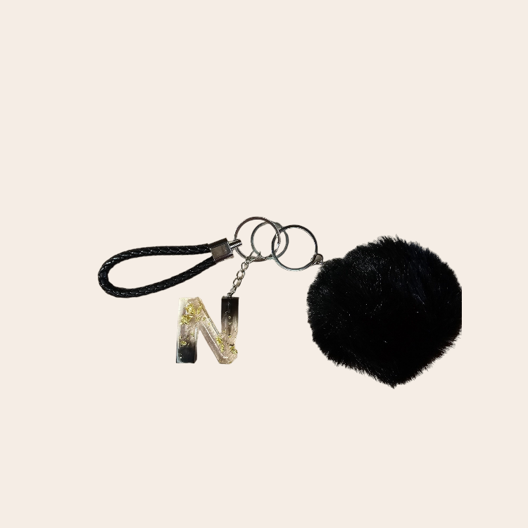 Keychain with handmade epoxy letter black, pompom and leather short